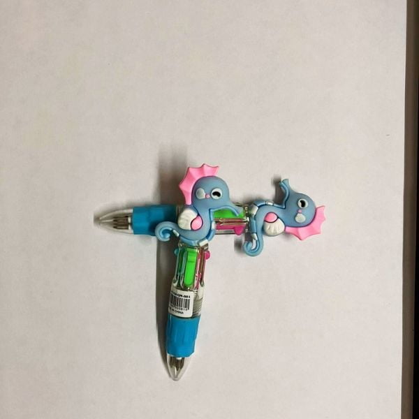 Two Unicorn pens stacked against each other