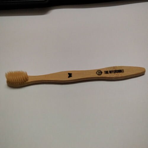 Bamboo Toothbrush kept against a light background.