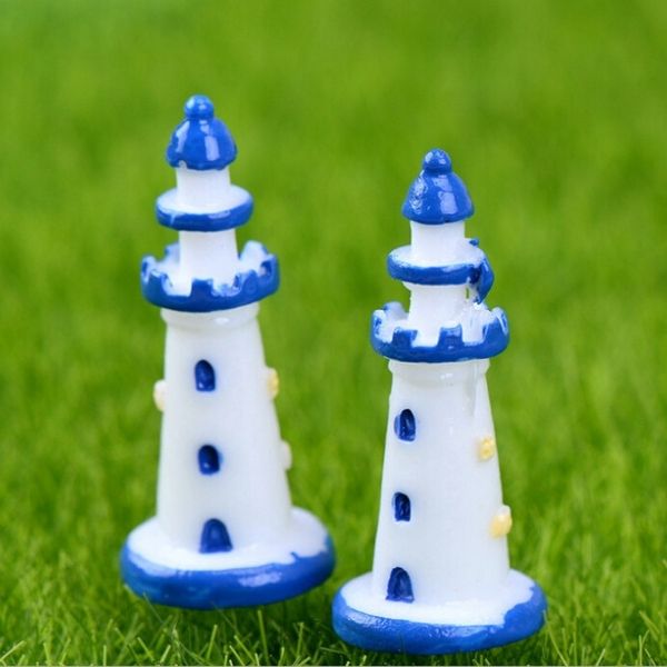 A beautiful Miniature Sea Side Watch Light Tower on a grass.