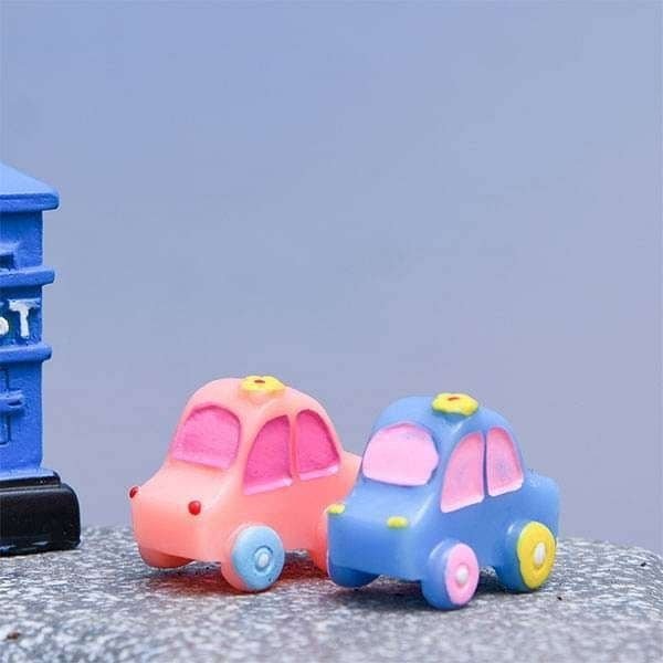 A cute and wonderful Miniature Toy Car on a rock.